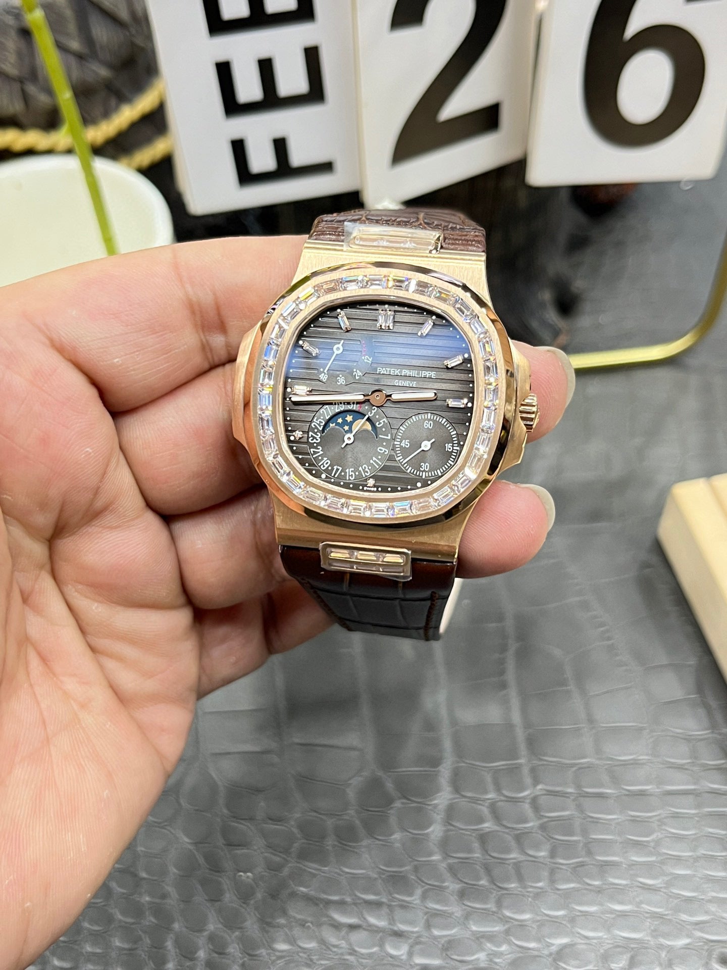 he Patek Philippe Nautilus 5712/1R-001 is a distinguished model in the Nautilus collection, renowned for its elegant design and sophisticated complications.