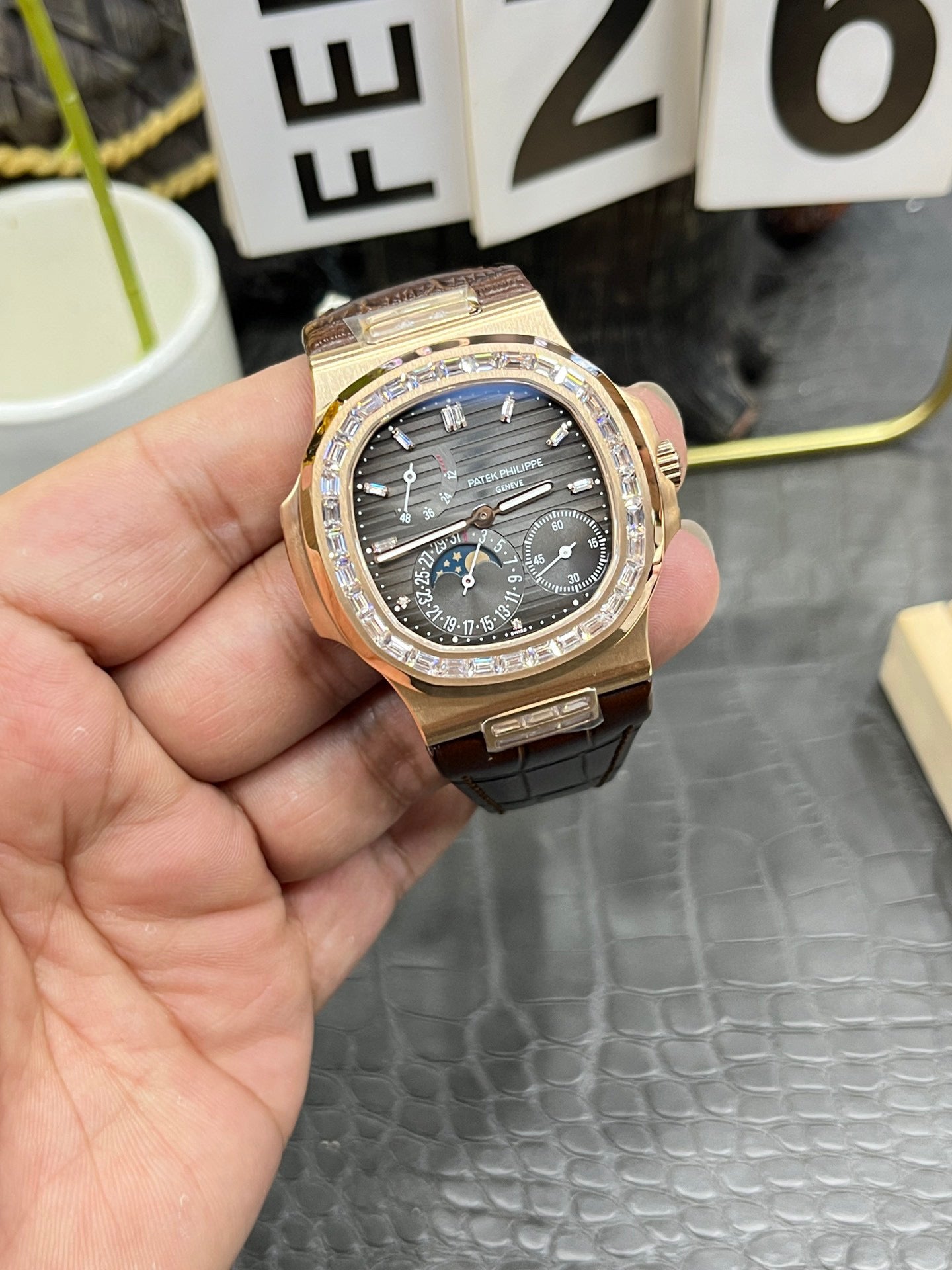 he Patek Philippe Nautilus 5712/1R-001 is a distinguished model in the Nautilus collection, renowned for its elegant design and sophisticated complications.